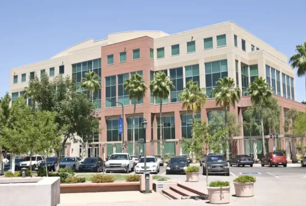 Commercial building with parking spaces in front.