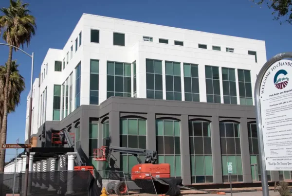 The building's exterior features a combination of white and gray colors.