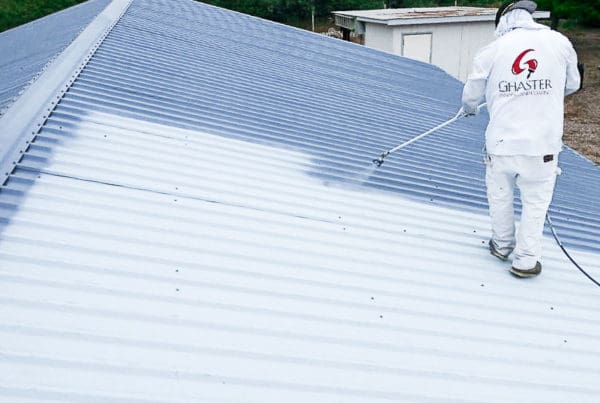 Ghaster painter staff working on painting the roof.